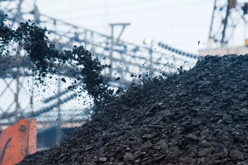 Reclaimed asphalt pavement being processed for reuse